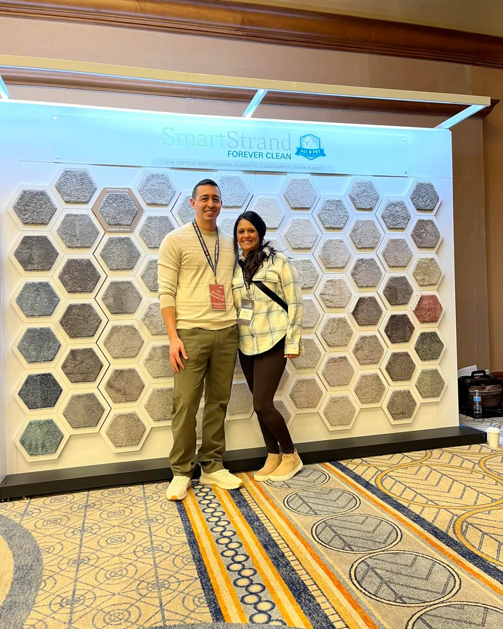 Best Flooring owners at a SmartStrand carpet showcase